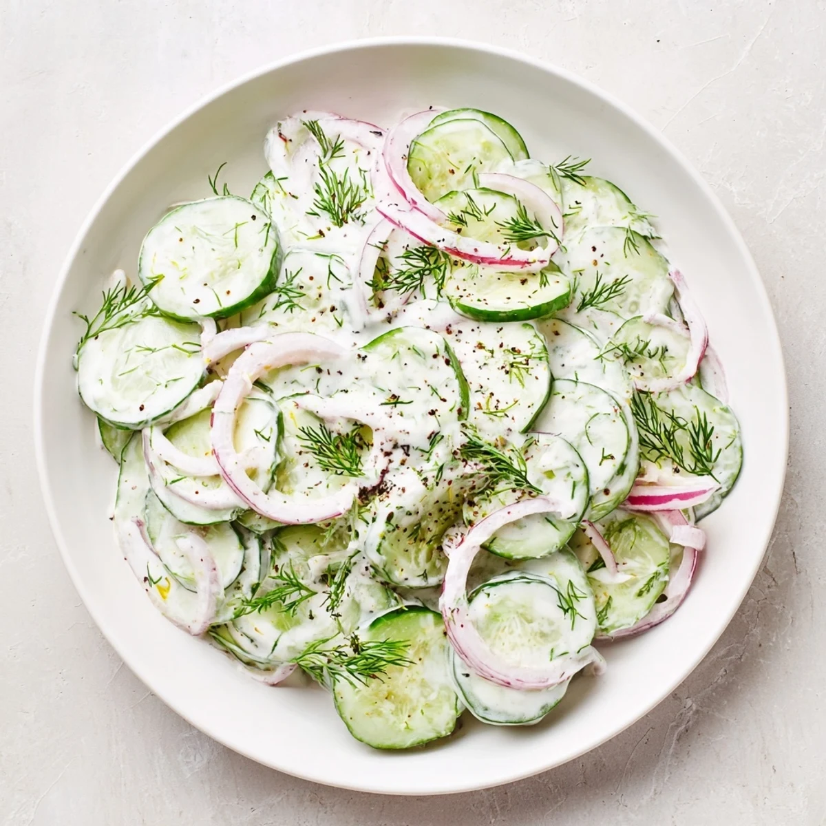 Creamy Cold Cucumber-Dill Salad with Yogurt, a summer delight, is cool and refreshing.