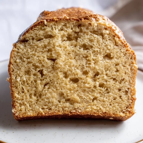Golden-brown Beer Bread Family Loaf, perfect with melting butter, fresh from the oven, ready to enjoy.