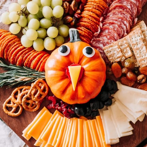 This festive Thanksgiving Wheat Field Turkey Board displays a creative arrangement of charcuterie favorites and fresh fruits.