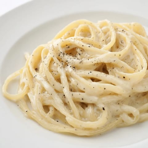 Steaming bowl of Lazy Girl Three-Ingredient Pasta, a quick and easy Italian-inspired vegetarian meal.
